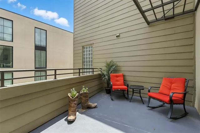 a backyard of a house with fire pit and chairs