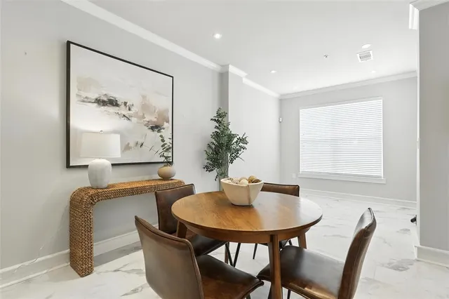 a dining room with furniture and window