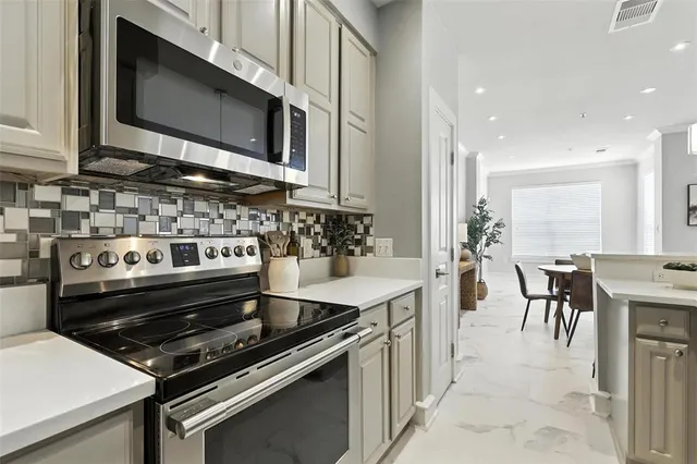 a kitchen with a stove and a microwave