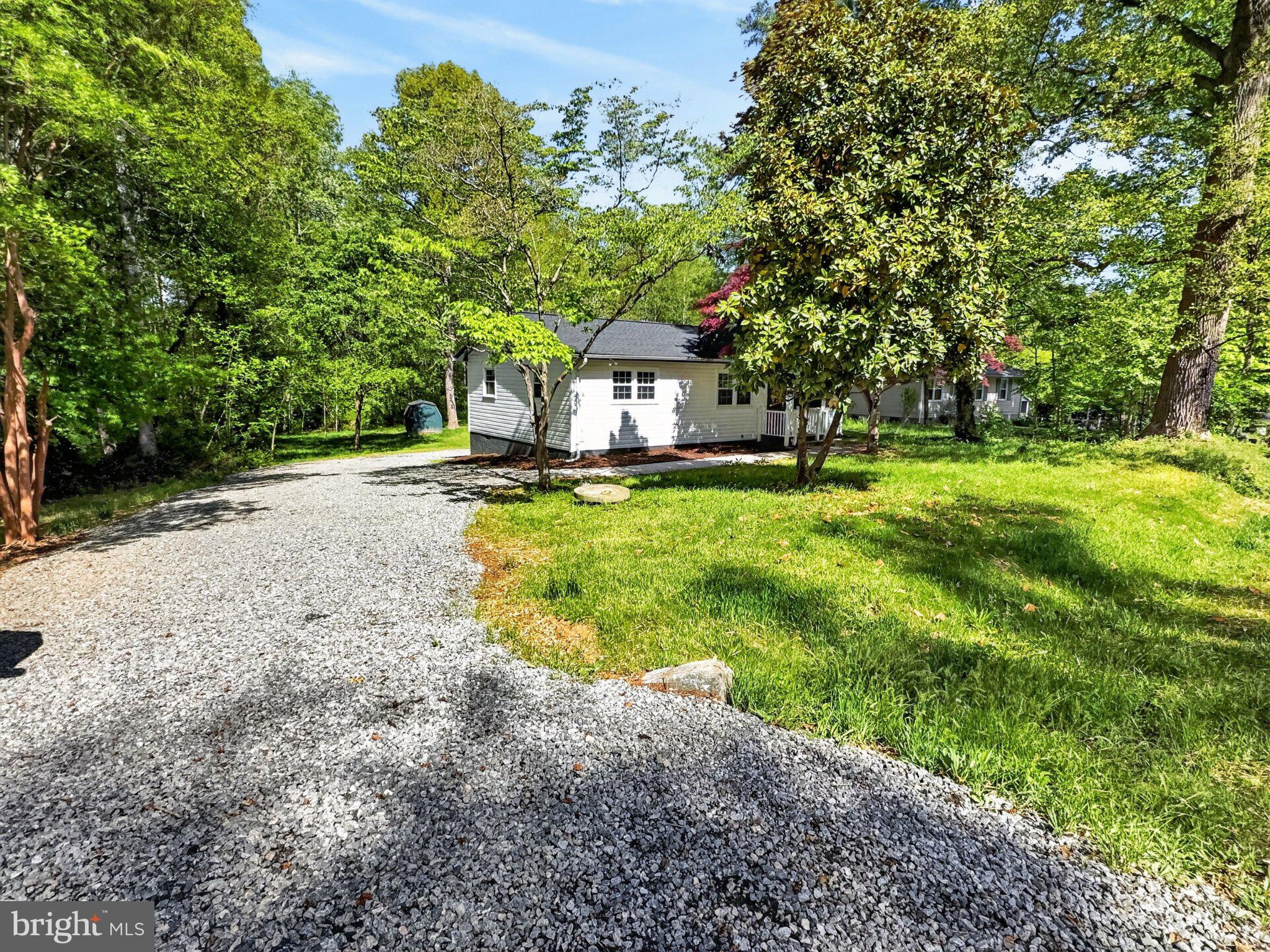5408 Towles Mill Road Partlow, VA 22534 - Photo 4 of 24 Charming home nestled in lush greenery.
