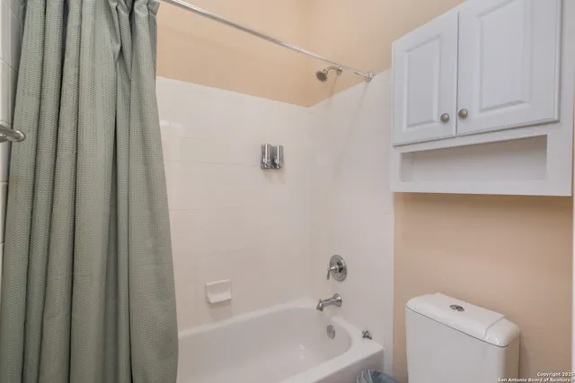 a view of a patio with a table and chairs and wooden floor