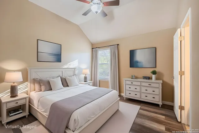 a balcony with wooden floor and fence