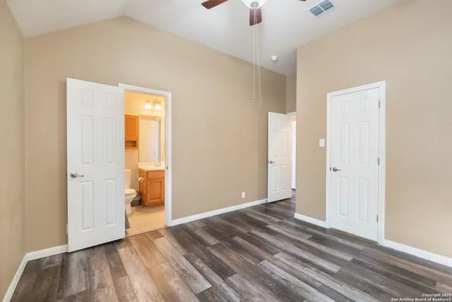 a view of a small house with a backyard