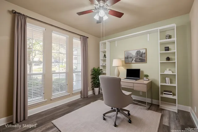 a view of a dining room with furniture wooden floor and chandelier