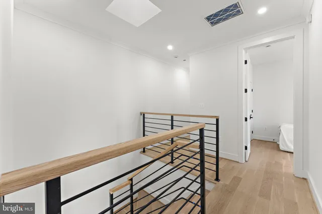 a room with pool table and windows