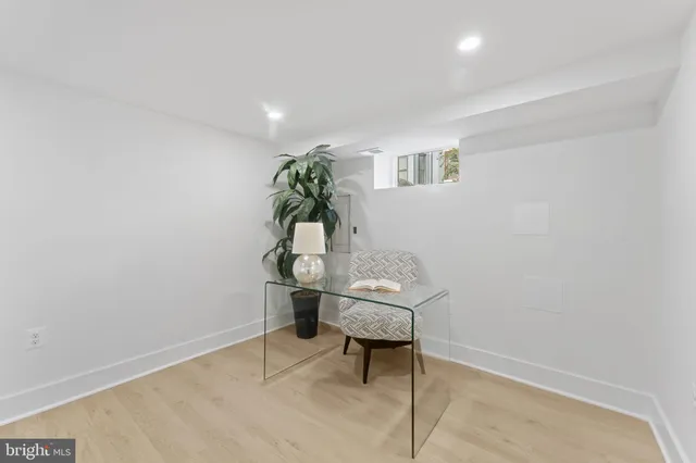 a bathroom with a toilet a sink a mirror a bathtub and vanity