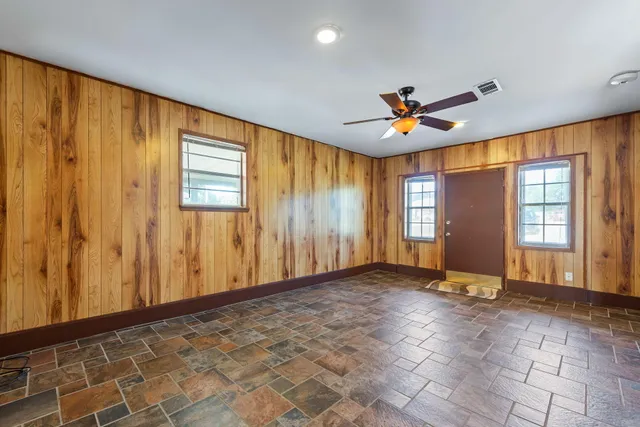 a view of an empty room with a window