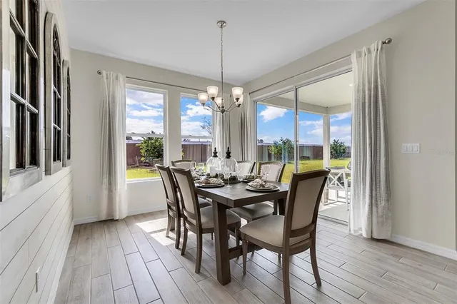 a view of a room with gym equipment and a large window