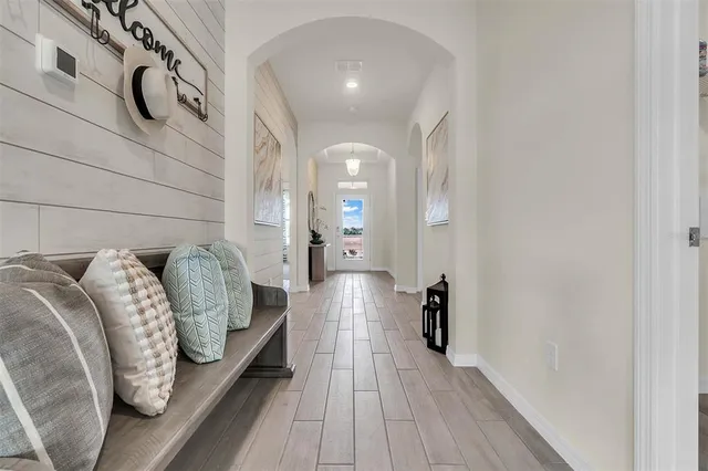 a view of a park with iron fence