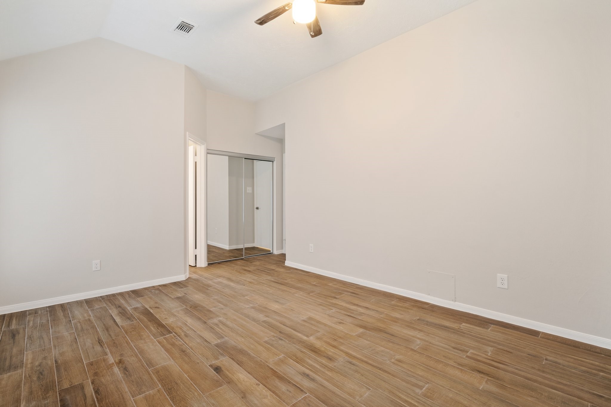 1931 Invermere Drive Spring, TX 77386 - Photo 14 of 24 a view of an empty room with wooden floor