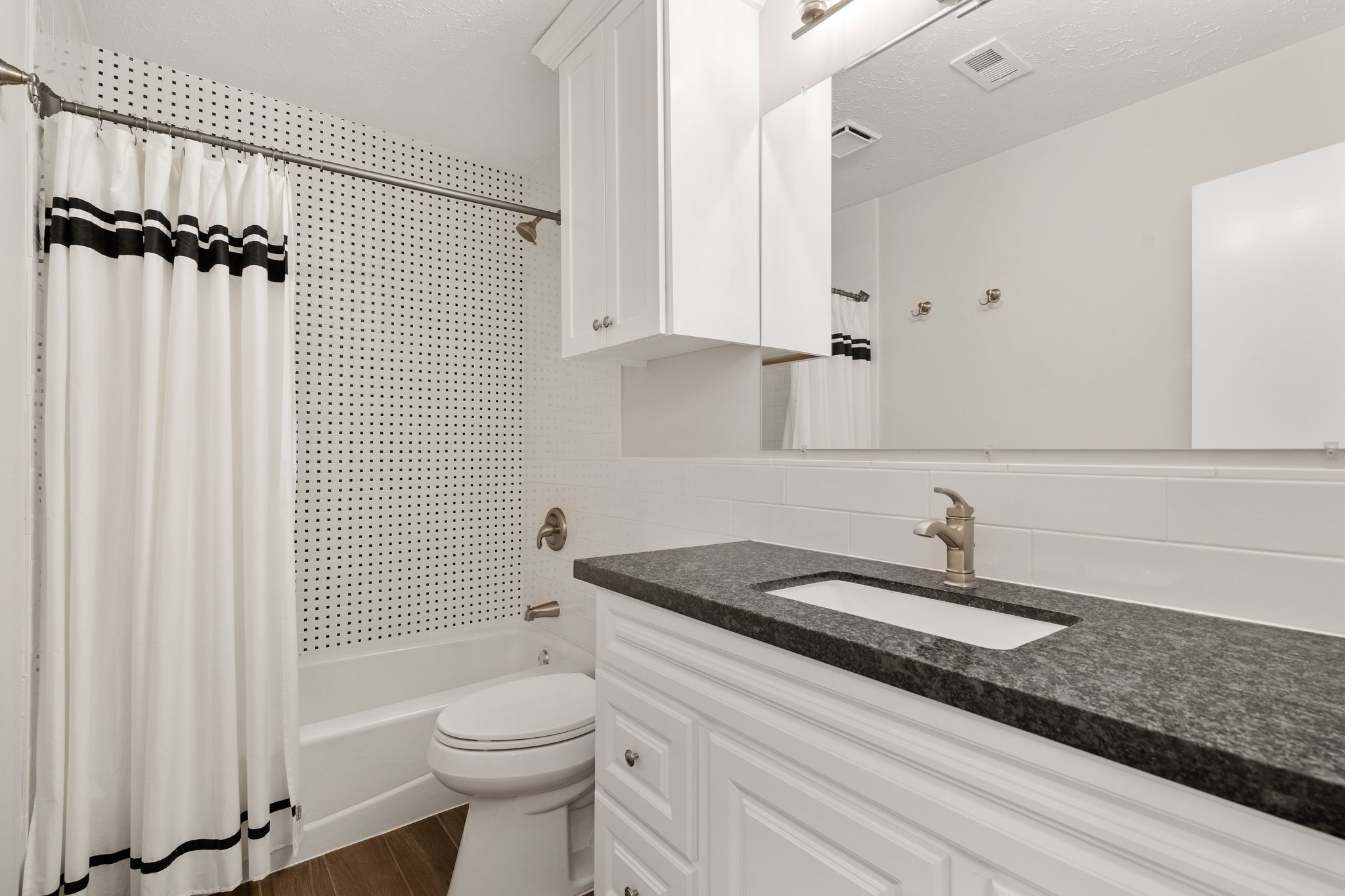 1931 Invermere Drive Spring, TX 77386 - Photo 19 of 24 a bathroom with a sink a toilet and shower