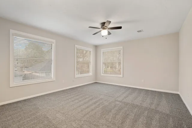 a view of empty room with windows