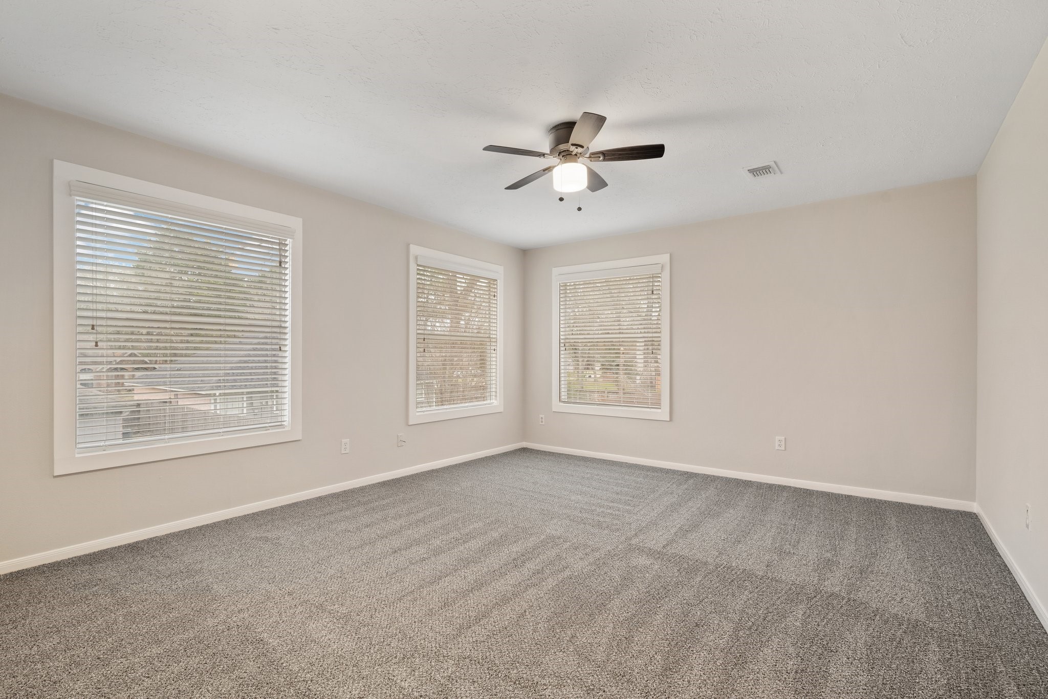 1931 Invermere Drive Spring, TX 77386 - Photo 20 of 24 a view of empty room with windows