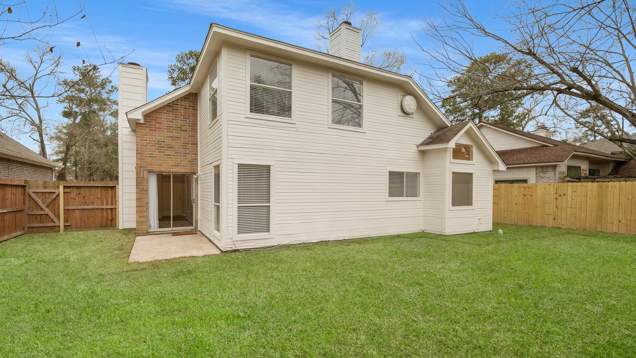 1931 Invermere Drive Spring, TX 77386 - Photo 22 of 24 a front view of a house with a yard
