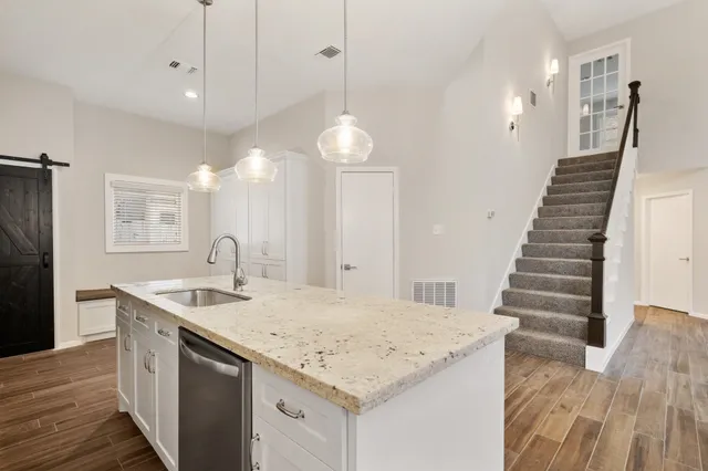 a kitchen with sink and center island