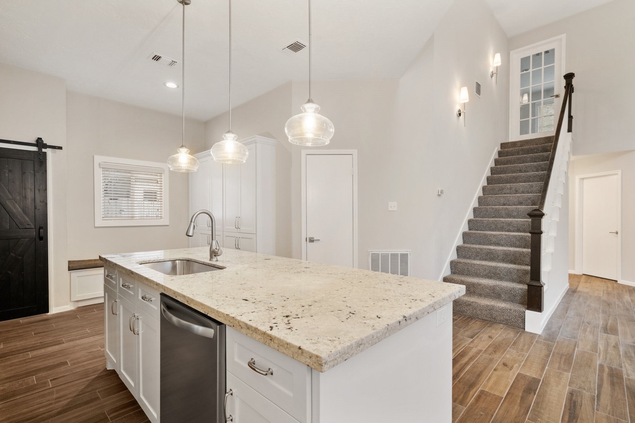 1931 Invermere Drive Spring, TX 77386 - Photo 10 of 24 a kitchen with sink and center island