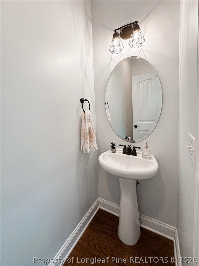 93 Falcon Ridge Drive Spring Lake, NC 28390 - Photo 35 of 50 a bathroom with a sink and mirror
