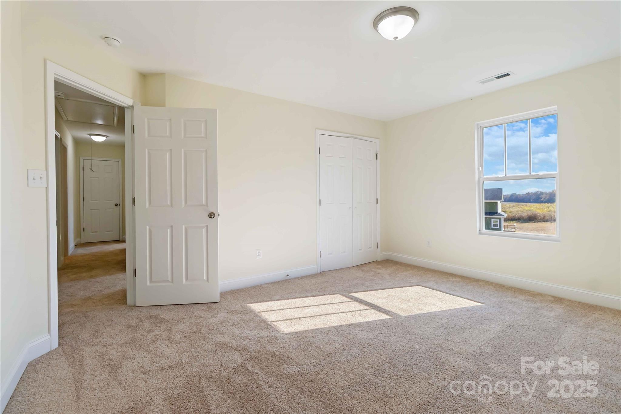 1006 Heath Helms Road Monroe, NC 28110 - Photo 20 of 48 an empty room with windows and closet