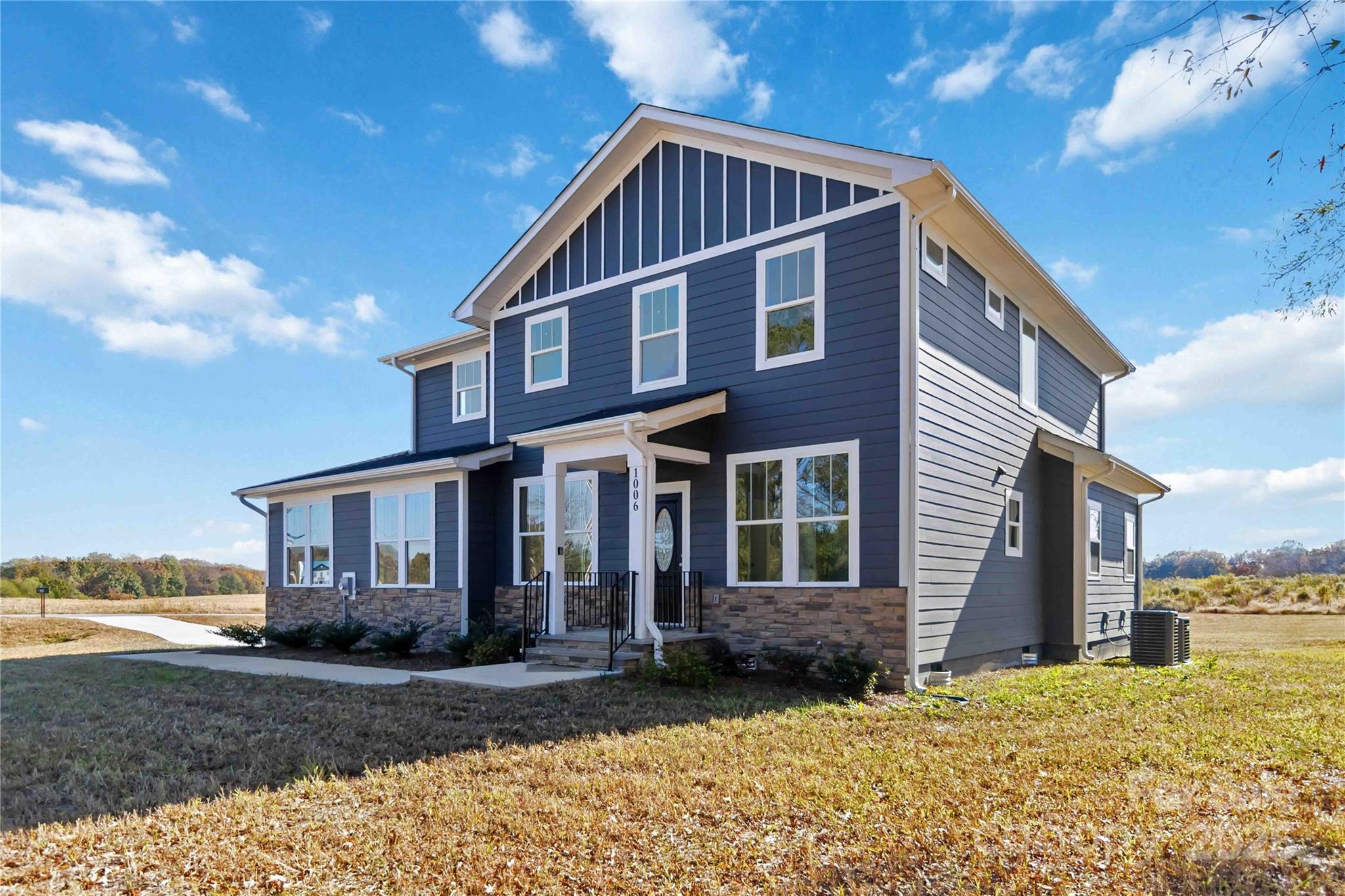1006 Heath Helms Road Monroe, NC 28110 - Photo 2 of 48 a view of a house with a yard