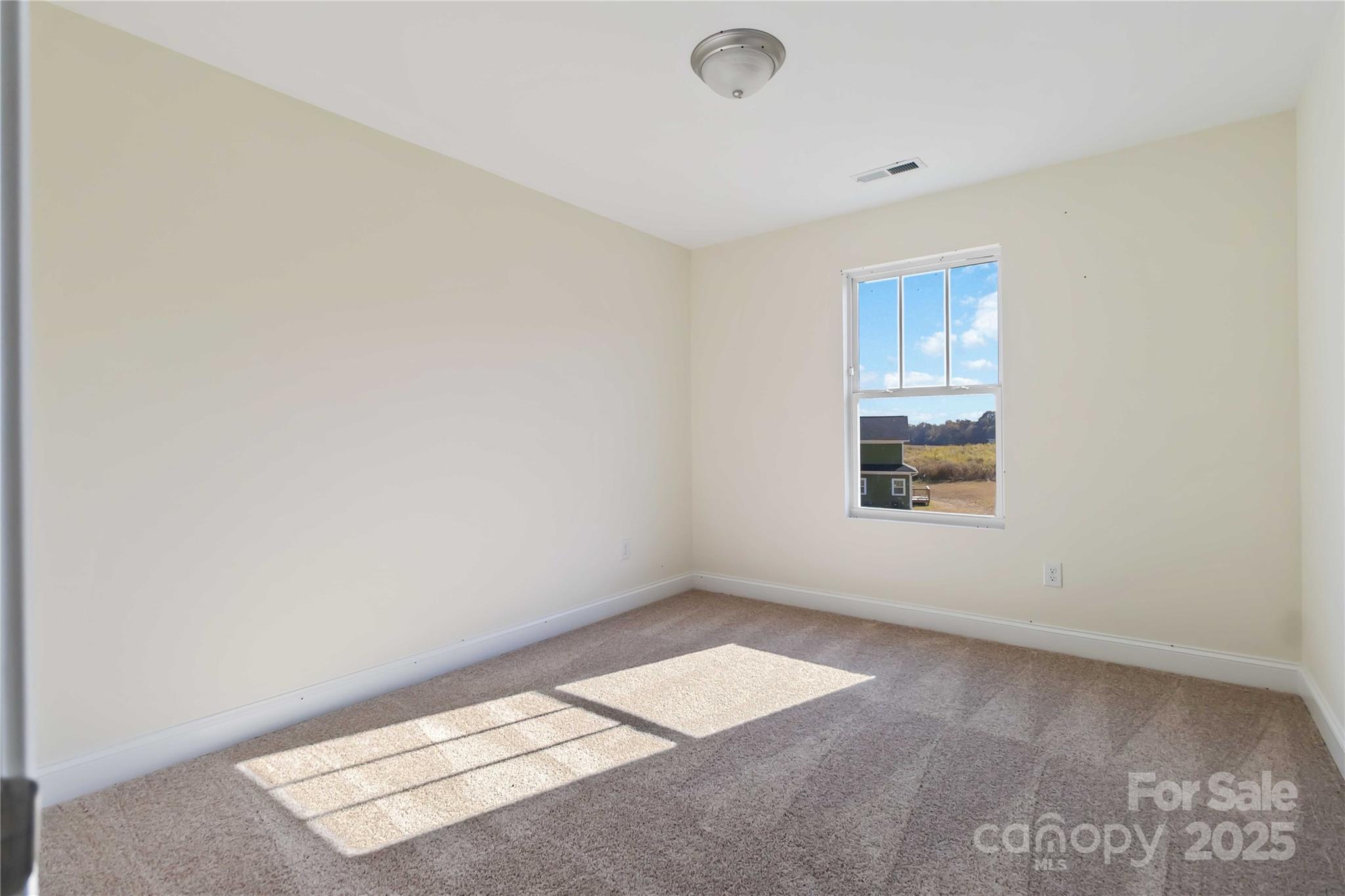 1006 Heath Helms Road Monroe, NC 28110 - Photo 21 of 48 an empty room with windows