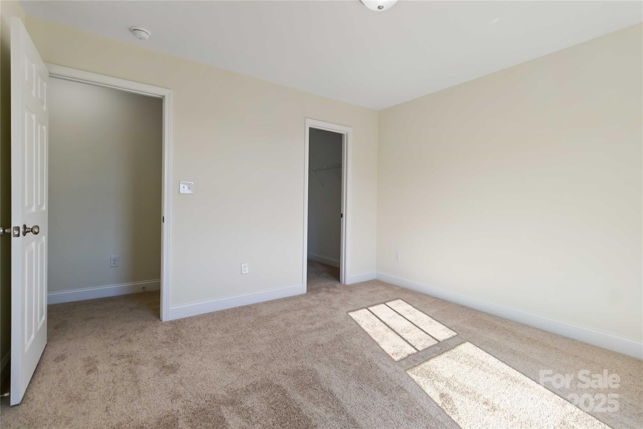 1006 Heath Helms Road Monroe, NC 28110 - Photo 26 of 48 an empty room with wooden floor and windows