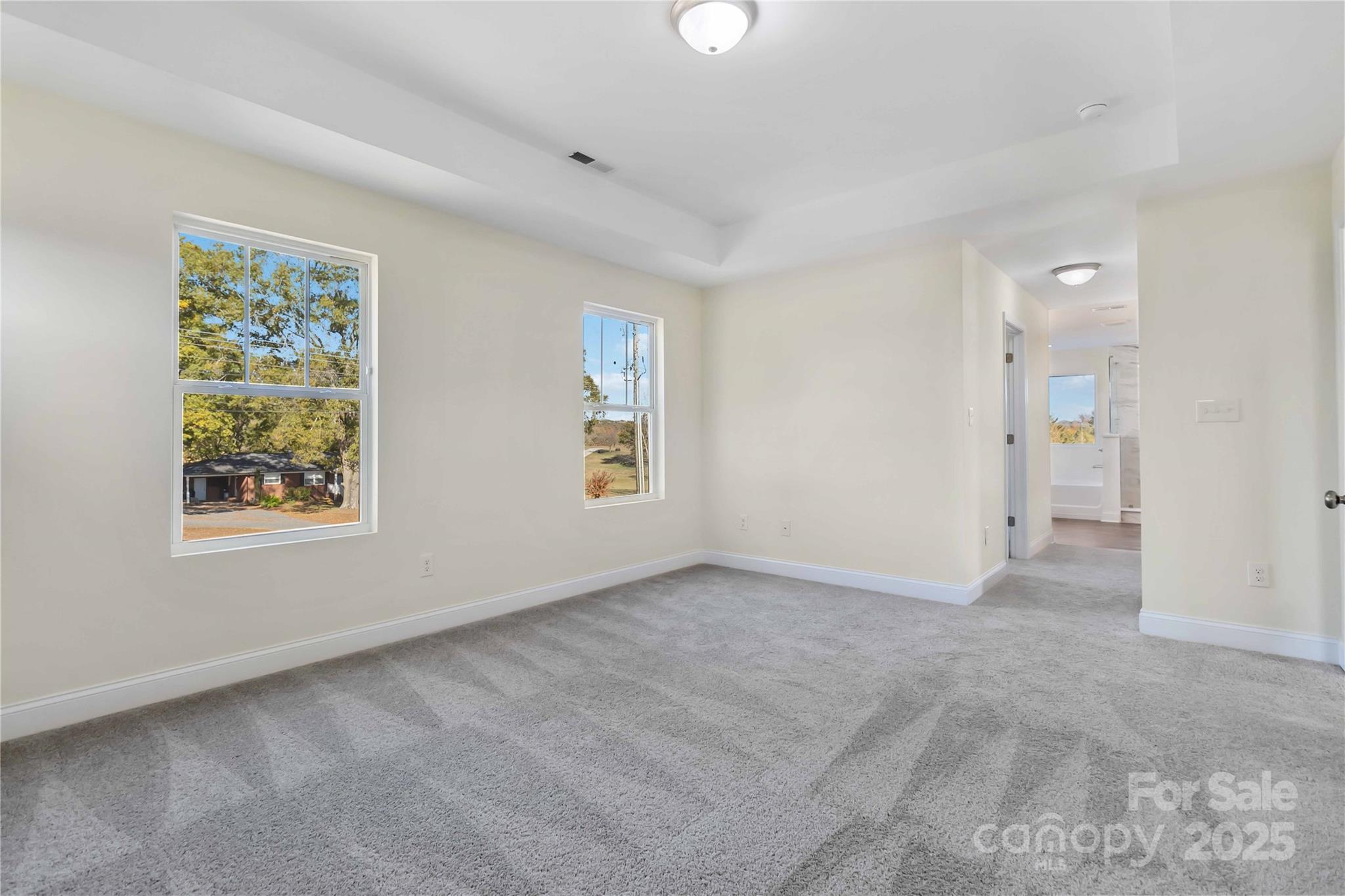 1006 Heath Helms Road Monroe, NC 28110 - Photo 29 of 48 an empty room with windows and closet