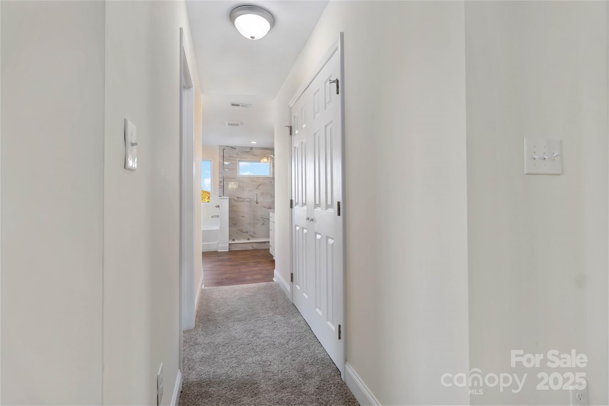 1006 Heath Helms Road Monroe, NC 28110 - Photo 30 of 48 a view of a hallway with wooden shelves