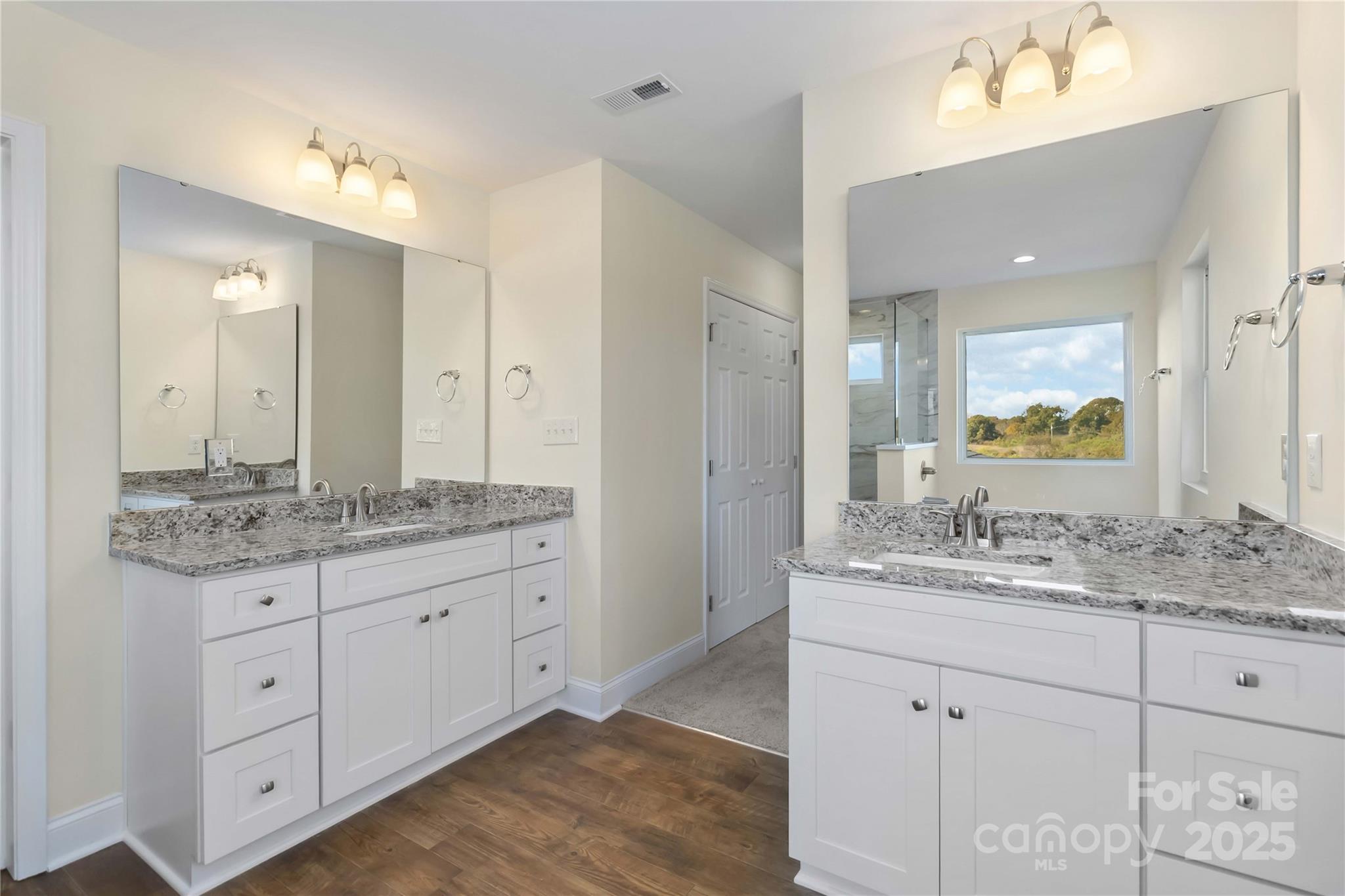 1006 Heath Helms Road Monroe, NC 28110 - Photo 33 of 48 a bathroom with a granite countertop sink double and mirror