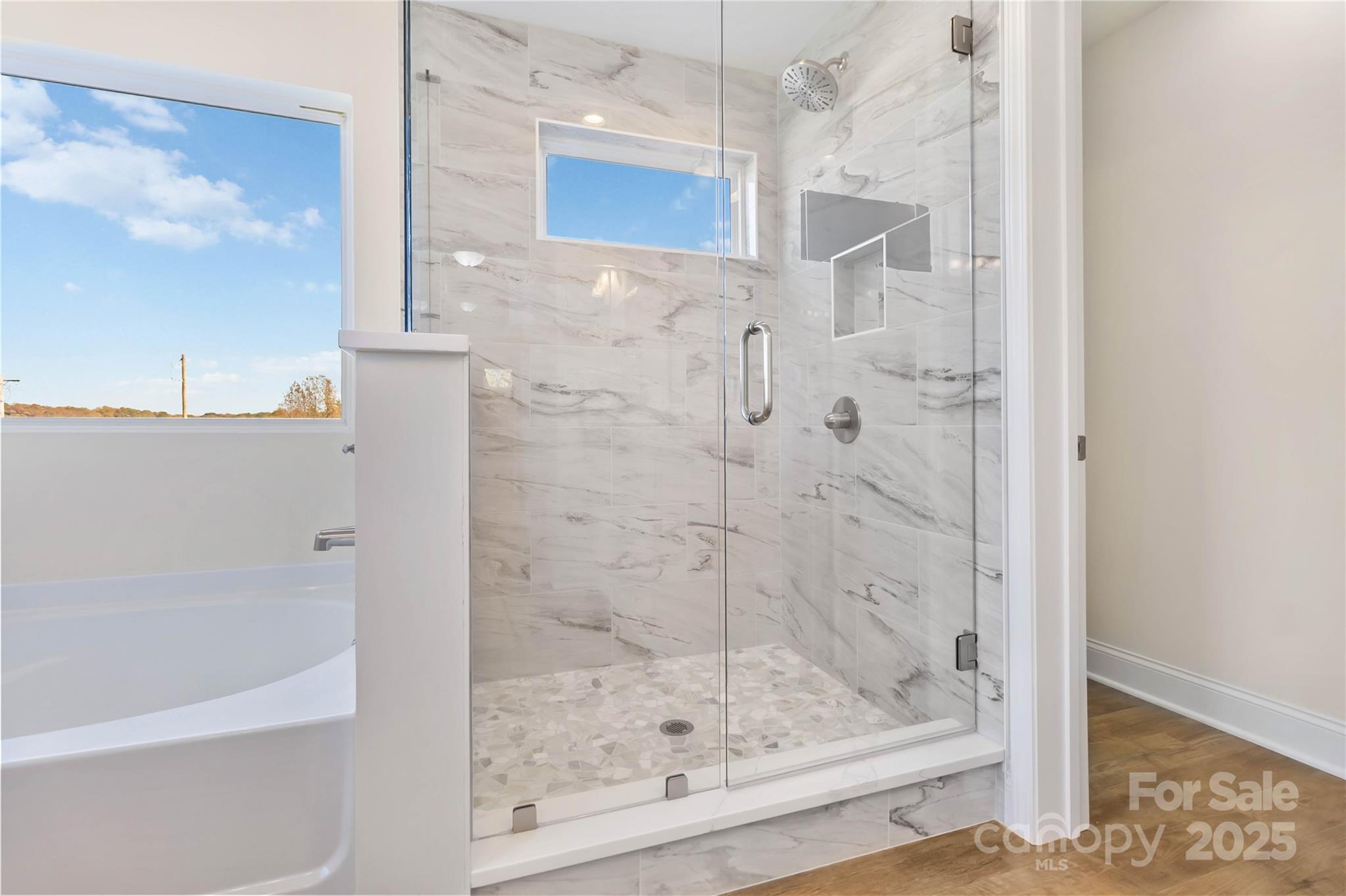 1006 Heath Helms Road Monroe, NC 28110 - Photo 35 of 48 a bathroom with a shower