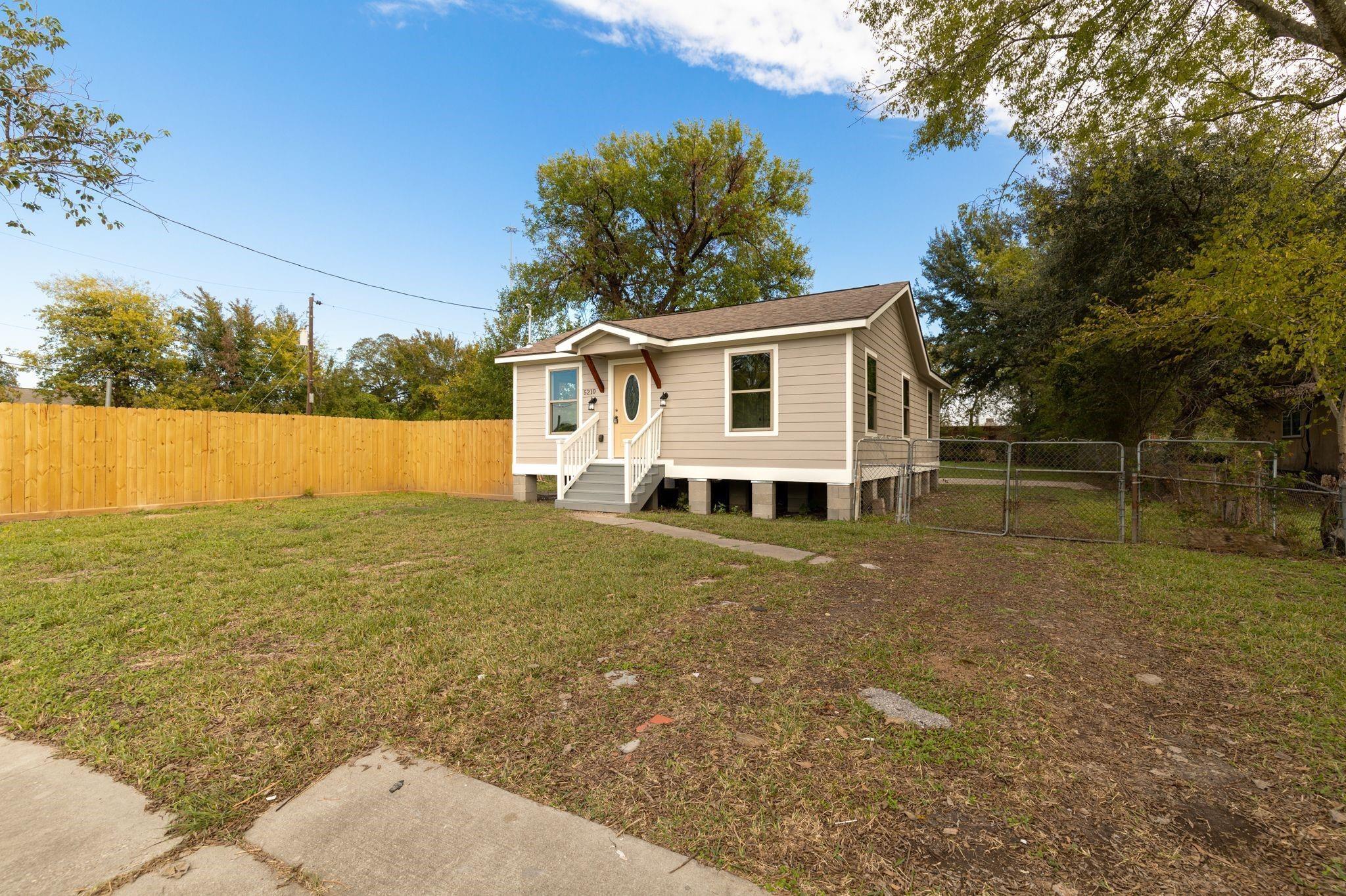 5210 Pickfair Street Houston, TX 77026 - Photo 1 of 18 a front view of a house with garden