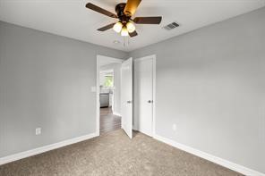 5210 Pickfair Street Houston, TX 77026 - Photo 12 of 18 an empty room and chandelier fan