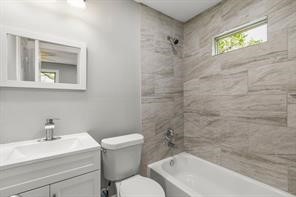 5210 Pickfair Street Houston, TX 77026 - Photo 16 of 18 a bathroom with a sink mirror toilet and bathtub