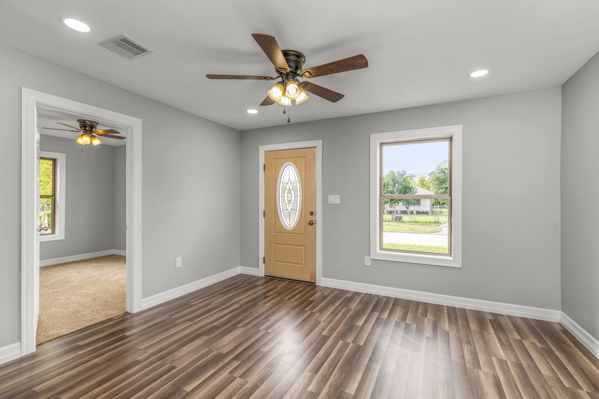 5210 Pickfair Street Houston, TX 77026 - Photo 6 of 18 a view of an empty room with window and wooden floor