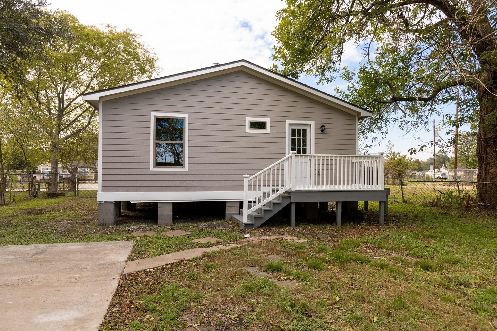 5210 Pickfair Street Houston, TX 77026 - Photo 8 of 18 a front view of a house with a garden