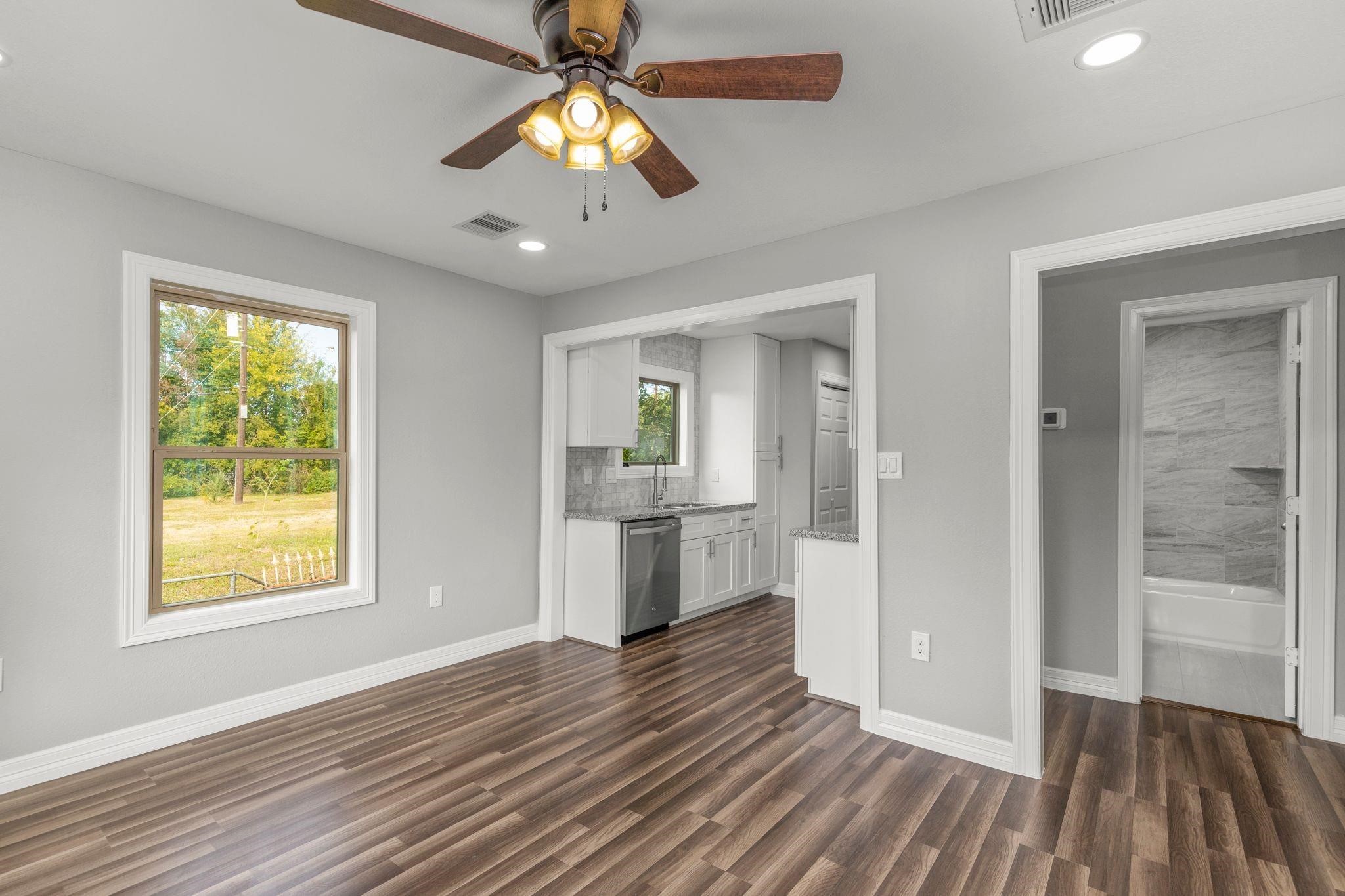 5210 Pickfair Street Houston, TX 77026 - Photo 9 of 18 wooden floor in an empty room with a window