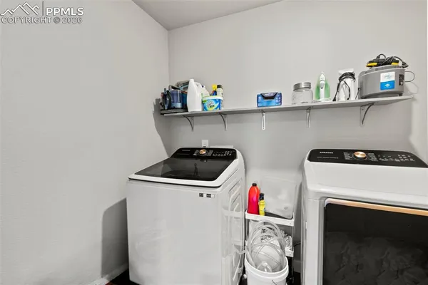 a utility room with dryer and washer