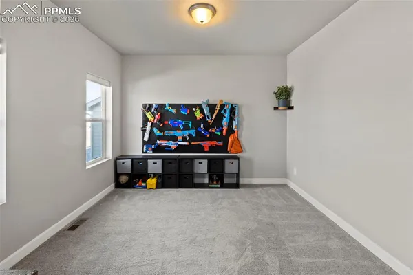 a view of play room with gym equipment