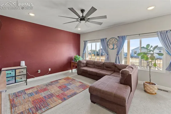 a living room with furniture and a large window