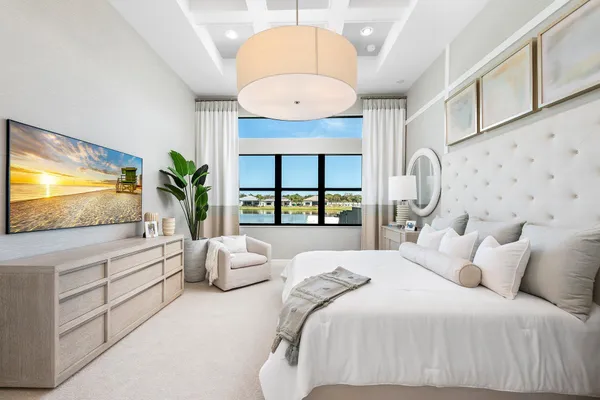 a bedroom with a large bed and a flat screen tv