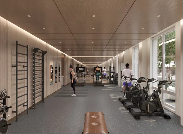 a kitchen with stainless steel appliances granite countertop a sink a stove a chimney and a refrigerator