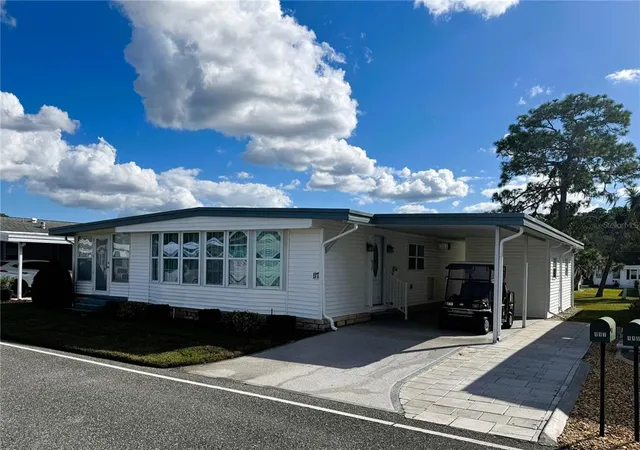 a view of a house with backyard and porch