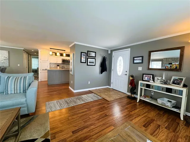 a view of a livingroom with furniture and wooden floor
