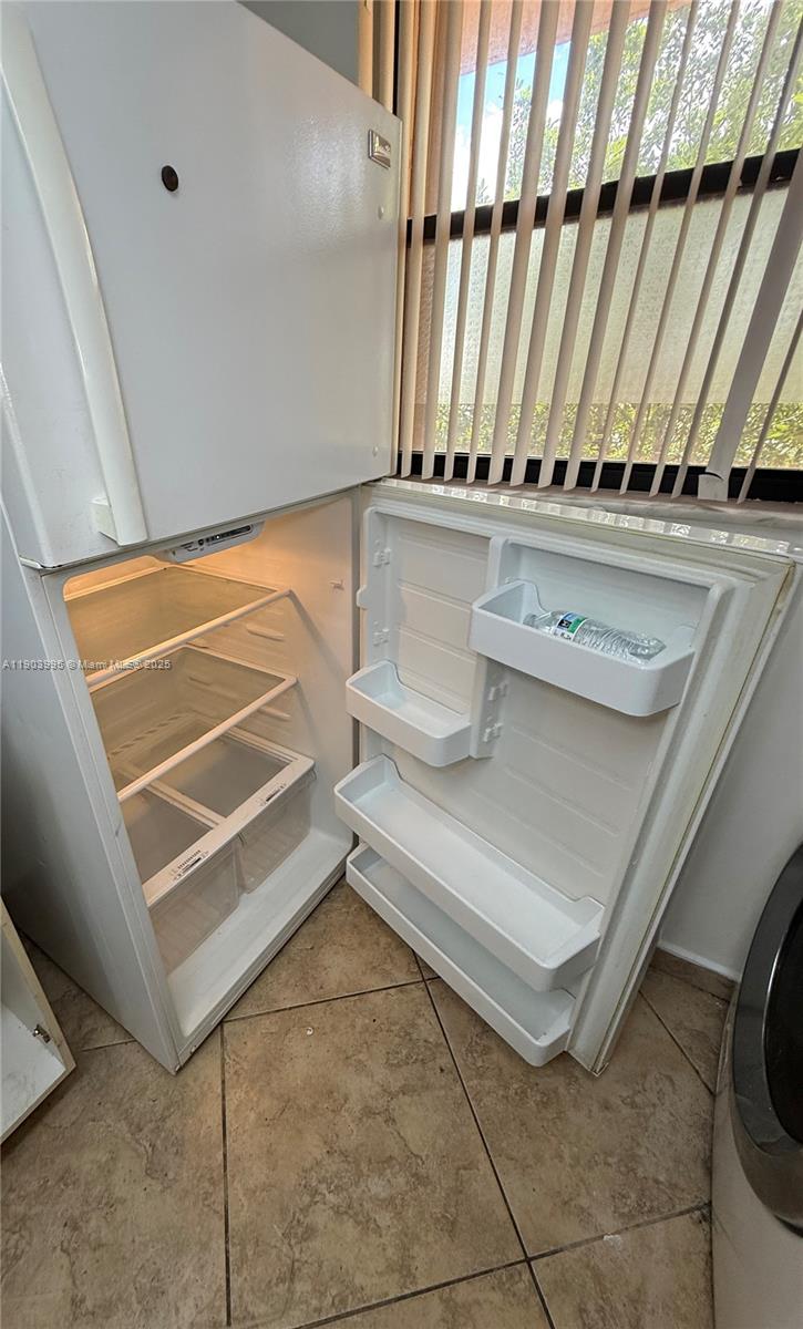10253 Northwest 9th St Circle, Unit 4066 Miami, FL 33172 - Photo 14 of 27 a view of a walk in closet