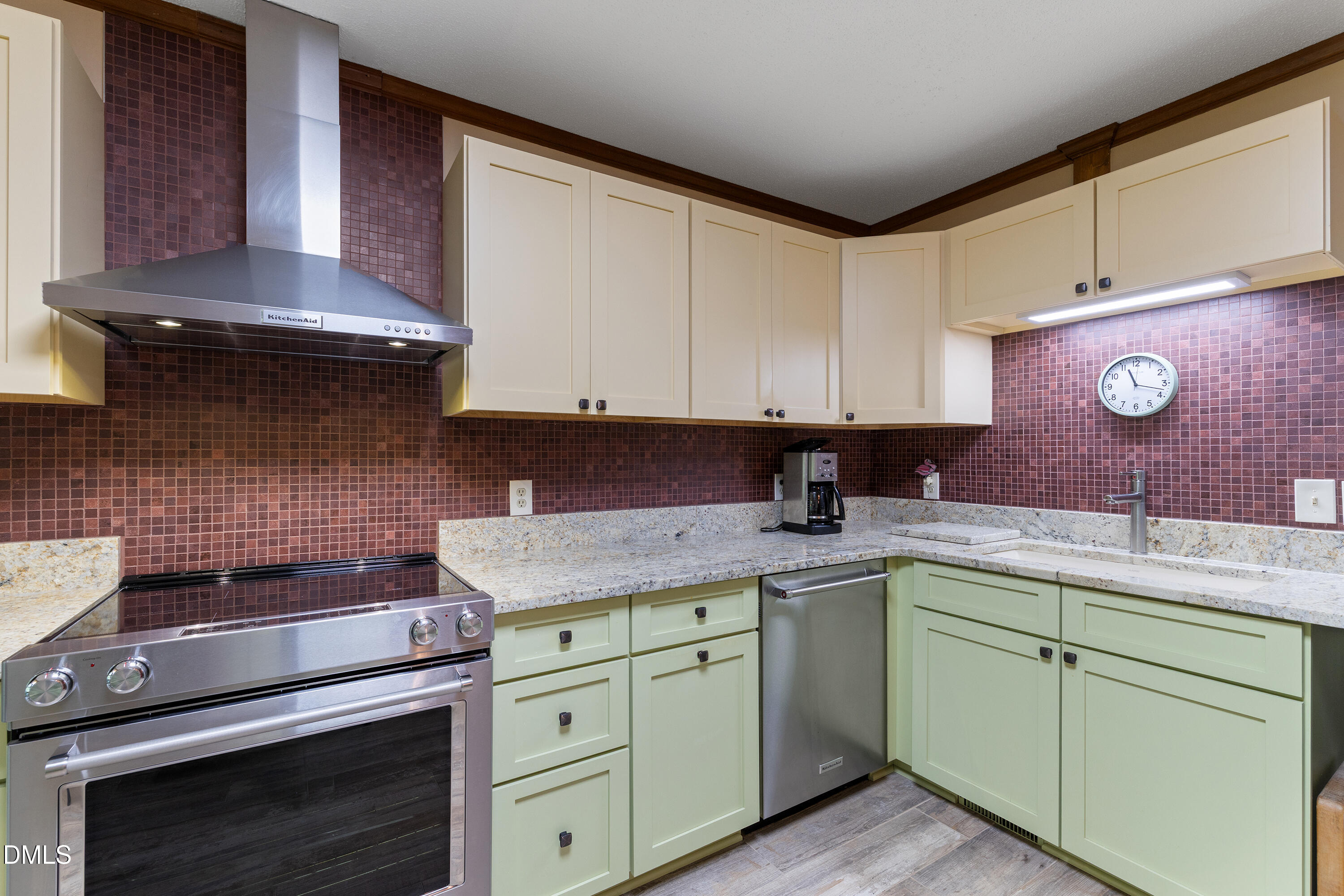 5216 Bridget Drive Raleigh, NC 27603 - Photo 6 of 30 a kitchen with a sink stove and cabinets