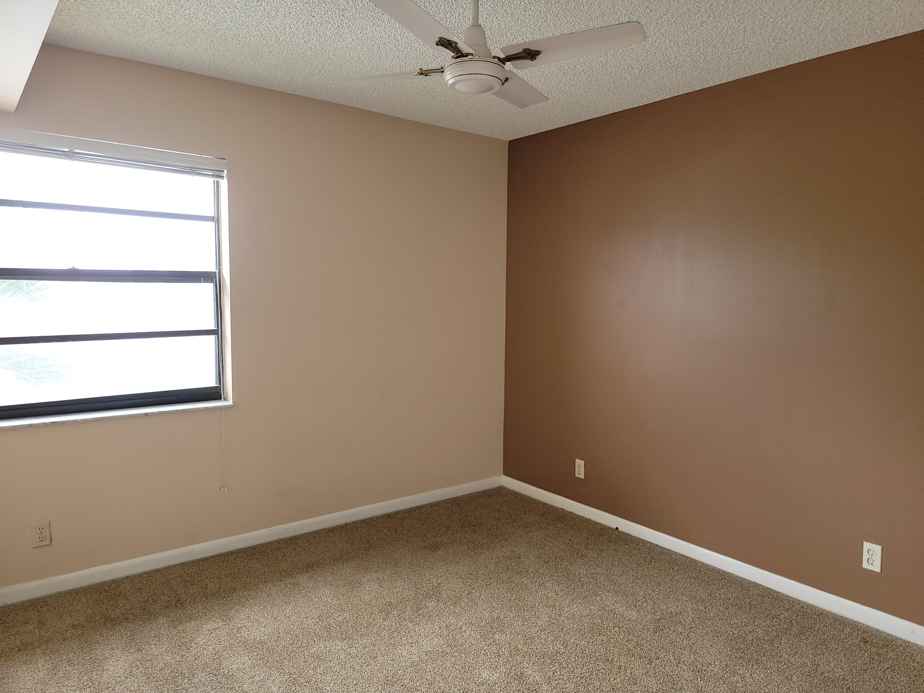 31 Capri A, Unit 31 Delray Beach, FL 33484 - Photo 12 of 13 an empty room with a window