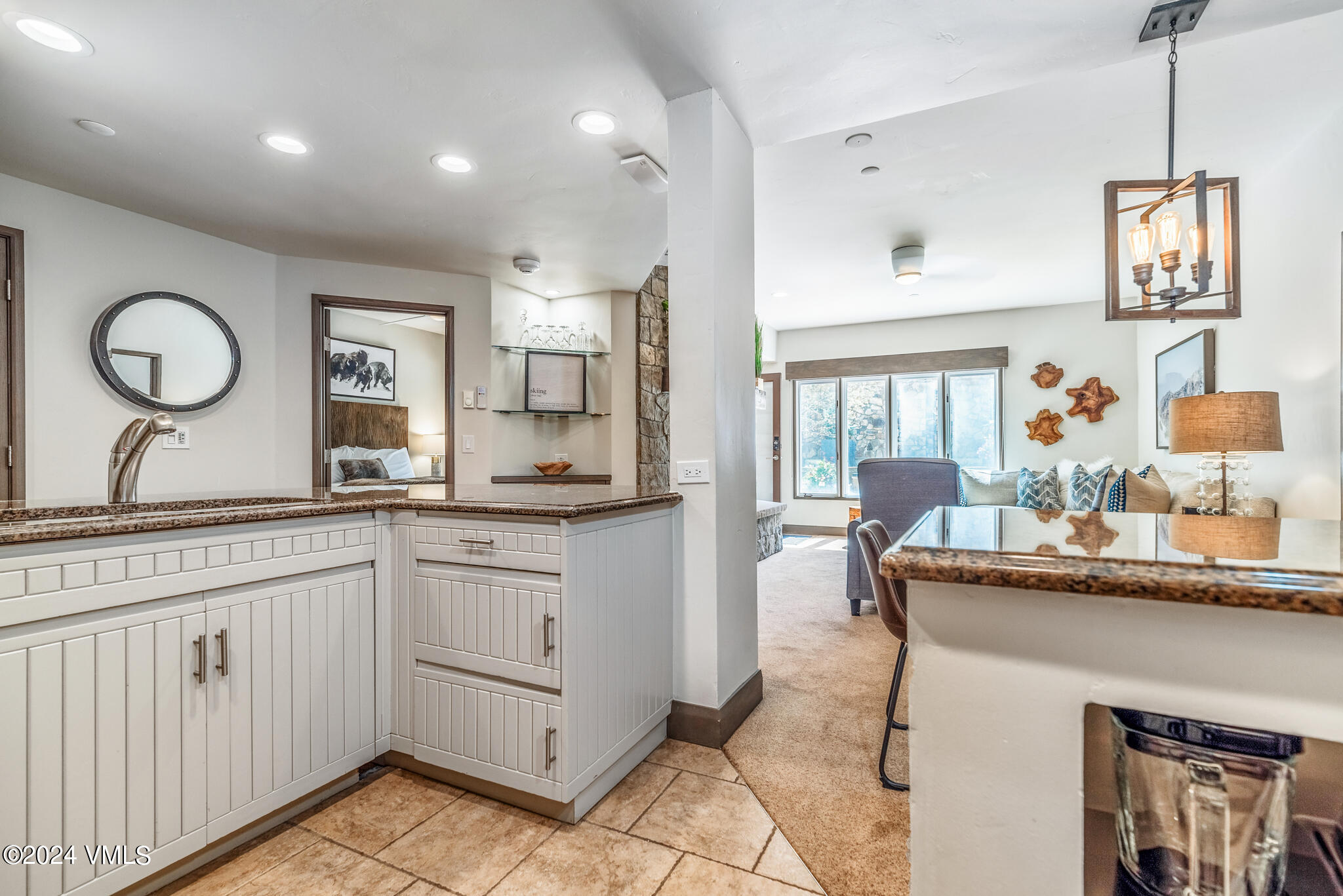 120 Offerson Road, Unit F230 Beaver Creek, CO 81620 - Photo 11 of 48 a very nice looking kitchen with granite countertop a sink cabinets and a large window