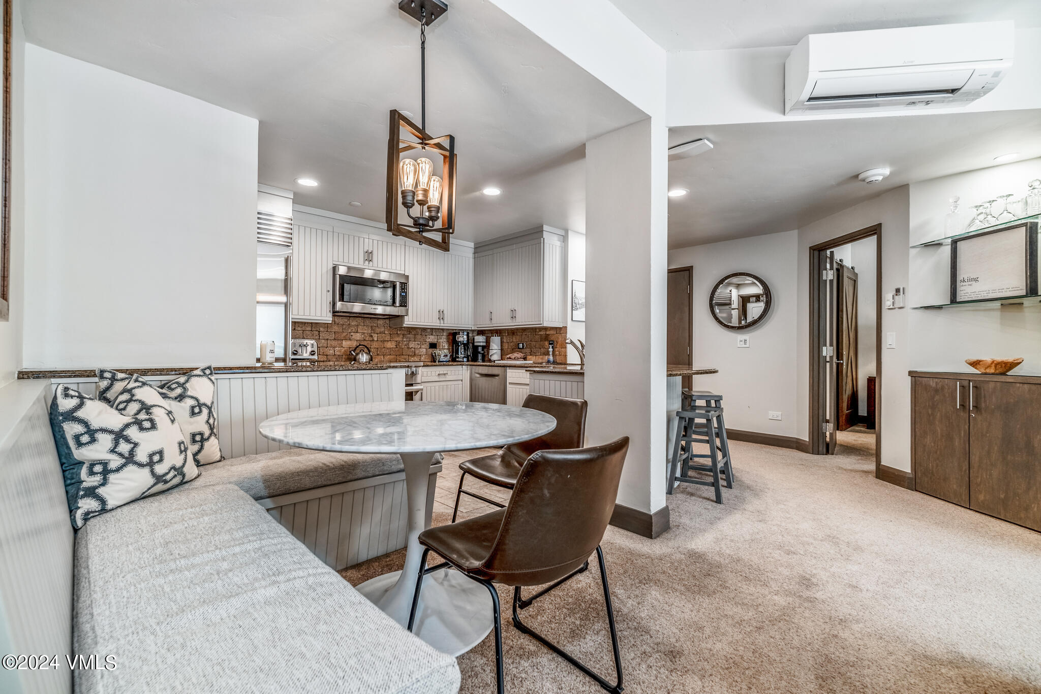 120 Offerson Road, Unit F230 Beaver Creek, CO 81620 - Photo 14 of 48 a kitchen with stainless steel appliances kitchen island granite countertop a sink and a refrigerator