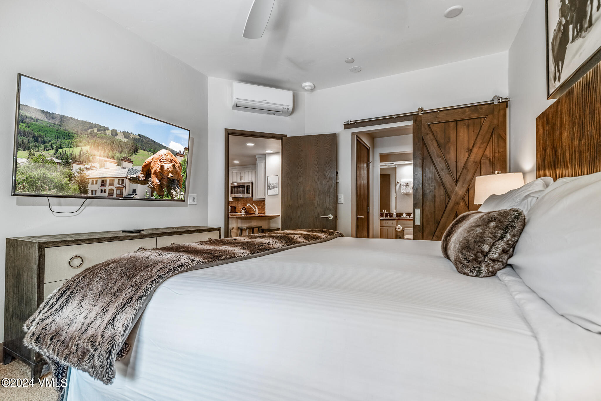 120 Offerson Road, Unit F230 Beaver Creek, CO 81620 - Photo 17 of 48 a bedroom with a bed and a large window