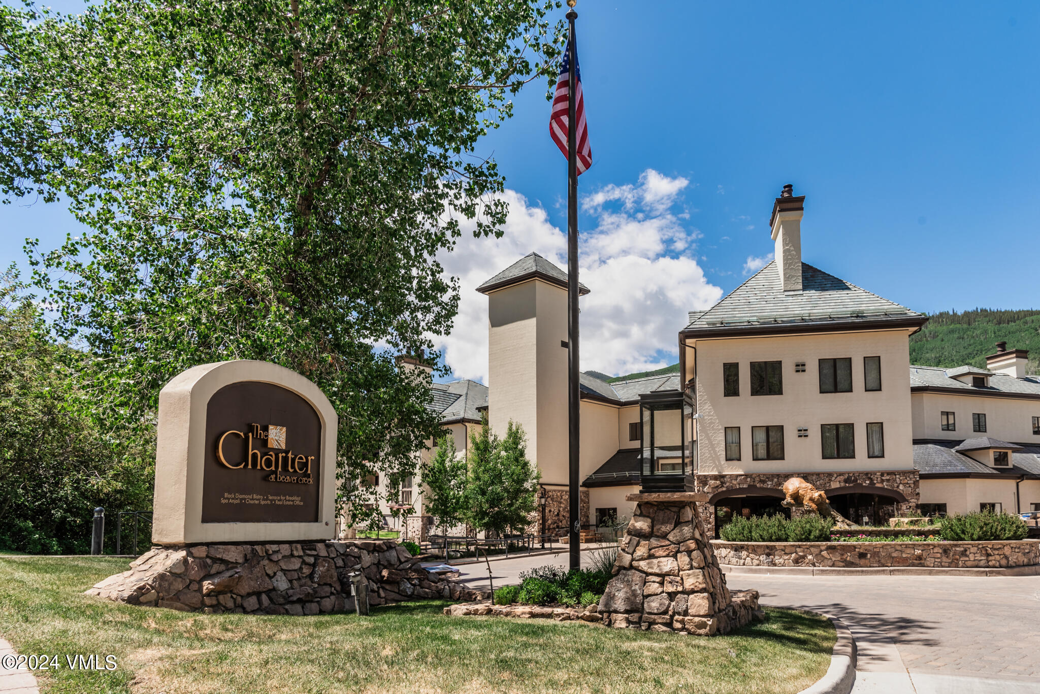 120 Offerson Road, Unit F230 Beaver Creek, CO 81620 - Photo 2 of 48 a front view of a house with a yard