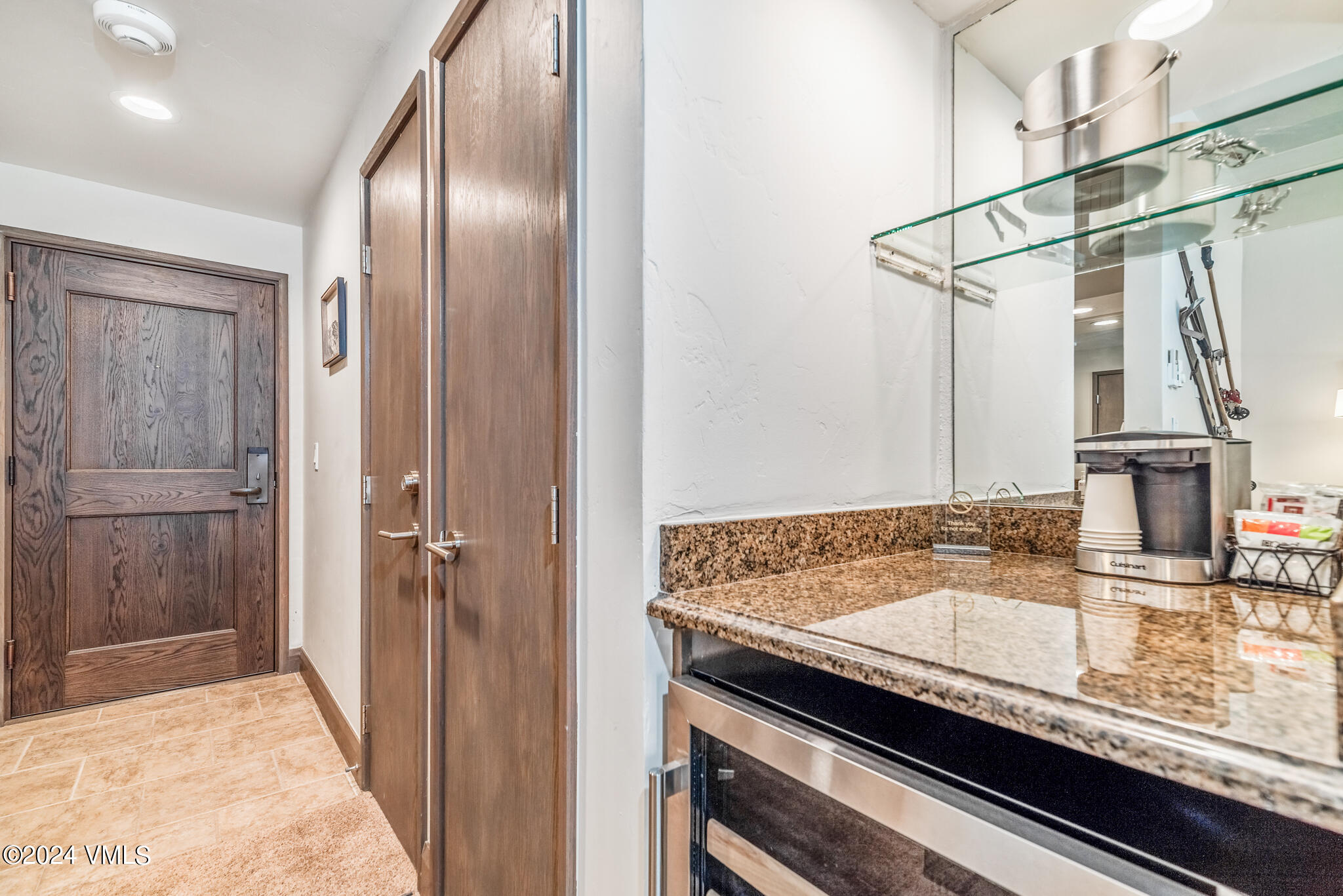 120 Offerson Road, Unit F230 Beaver Creek, CO 81620 - Photo 28 of 48 a bathroom with a granite countertop sink a mirror and shower